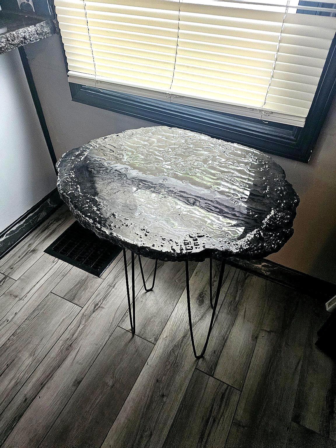 Midnight concrete table with dark epoxy finish